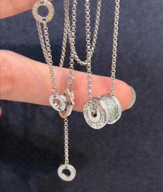 Bvlgari Silver Spiral Circle Pendant Necklace – Elegant Luxury Jewelry