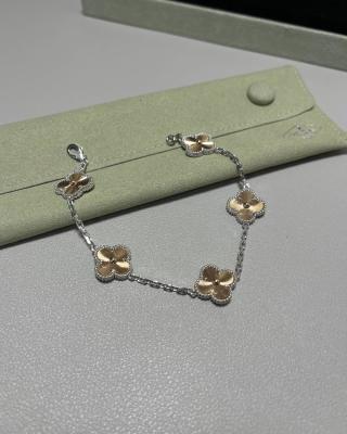 Van Cleef & Arpels Alhambra 5-motif bracelet featuring laser-engraved and mixed-color clover motifs.