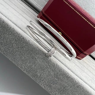 Cartier Juste un Clou bracelet, thick model, with diamonds at the ends and on the three-loop design.