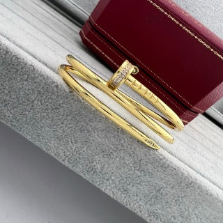 Cartier Juste un Clou bracelet, thick model, with diamonds at the ends and on the three-loop design.