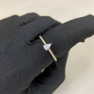 Cartier ring with a pear-shaped diamond center stone and diamond accents
