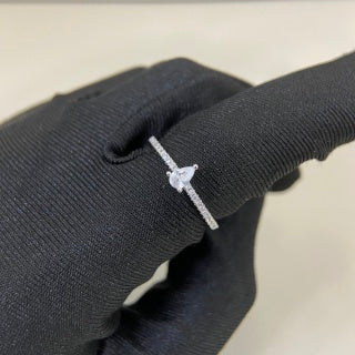 Cartier ring with a pear-shaped diamond center stone and diamond accents
