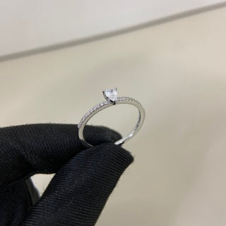 Cartier ring with a pear-shaped diamond center stone and diamond accents