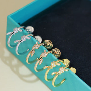 Tiffany Knot Stud Earrings – Polished Finish with Half-Pavé Diamonds