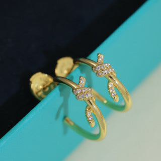 Tiffany Knot Stud Earrings – Polished Finish with Half-Pavé Diamonds