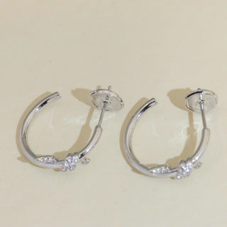 Tiffany Knot Stud Earrings – Polished Finish with Half-Pavé Diamonds