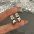 Cartier single-diamond half-hoop earrings