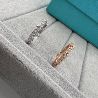 Tiffany narrow ring with three diamonds set between X-shaped motifs