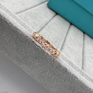 Tiffany narrow ring with three diamonds set between X-shaped motifs