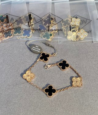Van Cleef & Arpels 5-Motif Clover Bracelet with White Mother-of-Pearl, Black Onyx, and Gold-Tone Accents