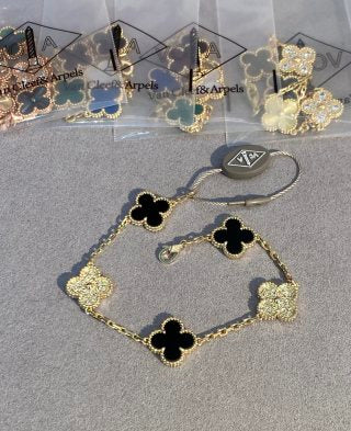 Van Cleef & Arpels 5-Motif Clover Bracelet with White Mother-of-Pearl, Black Onyx, and Gold-Tone Accents
