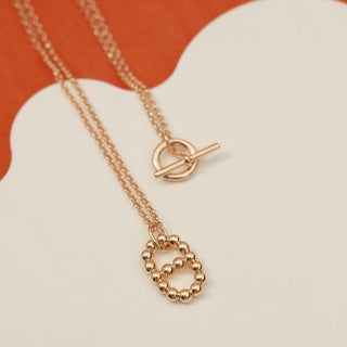 Hermès Beaded Oval Loop Pendant Necklace