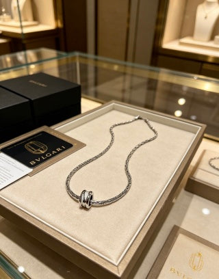 Bvlgari Silver Spiral Circle Pendant Necklace – Elegant Luxury Jewelry
