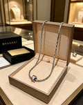 Bvlgari Silver Spiral Circle Pendant Necklace – Elegant Luxury Jewelry