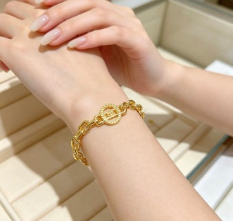 Bvlgari Gold Medallion Link Bracelet – Elegant Luxury Jewelry