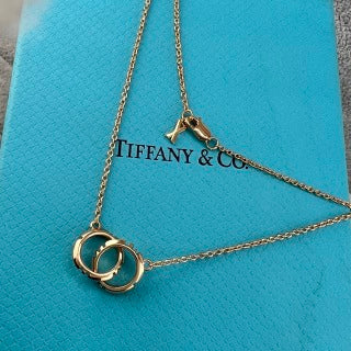 Tiffany & Co. Double-Clasp High-Polish Gold Circle Pendant Necklace with Knife-Edge Detail