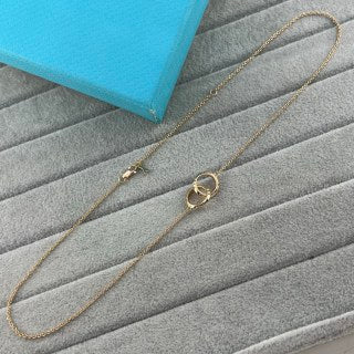 Tiffany & Co. Double-Clasp High-Polish Gold Circle Pendant Necklace with Knife-Edge Detail