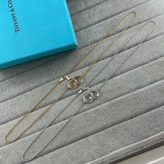 Tiffany & Co. Double-Clasp High-Polish Gold Circle Pendant Necklace with Knife-Edge Detail
