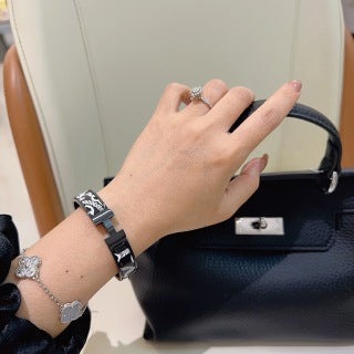 Hermès Black Enamel Signature Hinge Bracelet