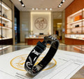 Hermès Black Enamel Signature Hinge Bracelet