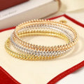 CARTIER Ravelle Studded Orbit Bangle