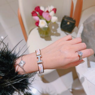 Hermès White Enamel Signature Hinge Bracelet