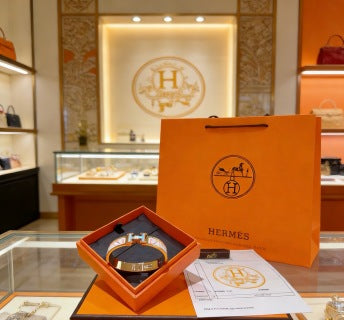 Hermès White Enamel Signature Hinge Bracelet