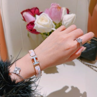 Hermès White Enamel Signature Hinge Bracelet