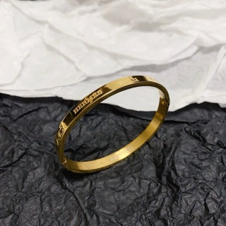 Hermès Engraved Signature Slim Cuff Bracelet